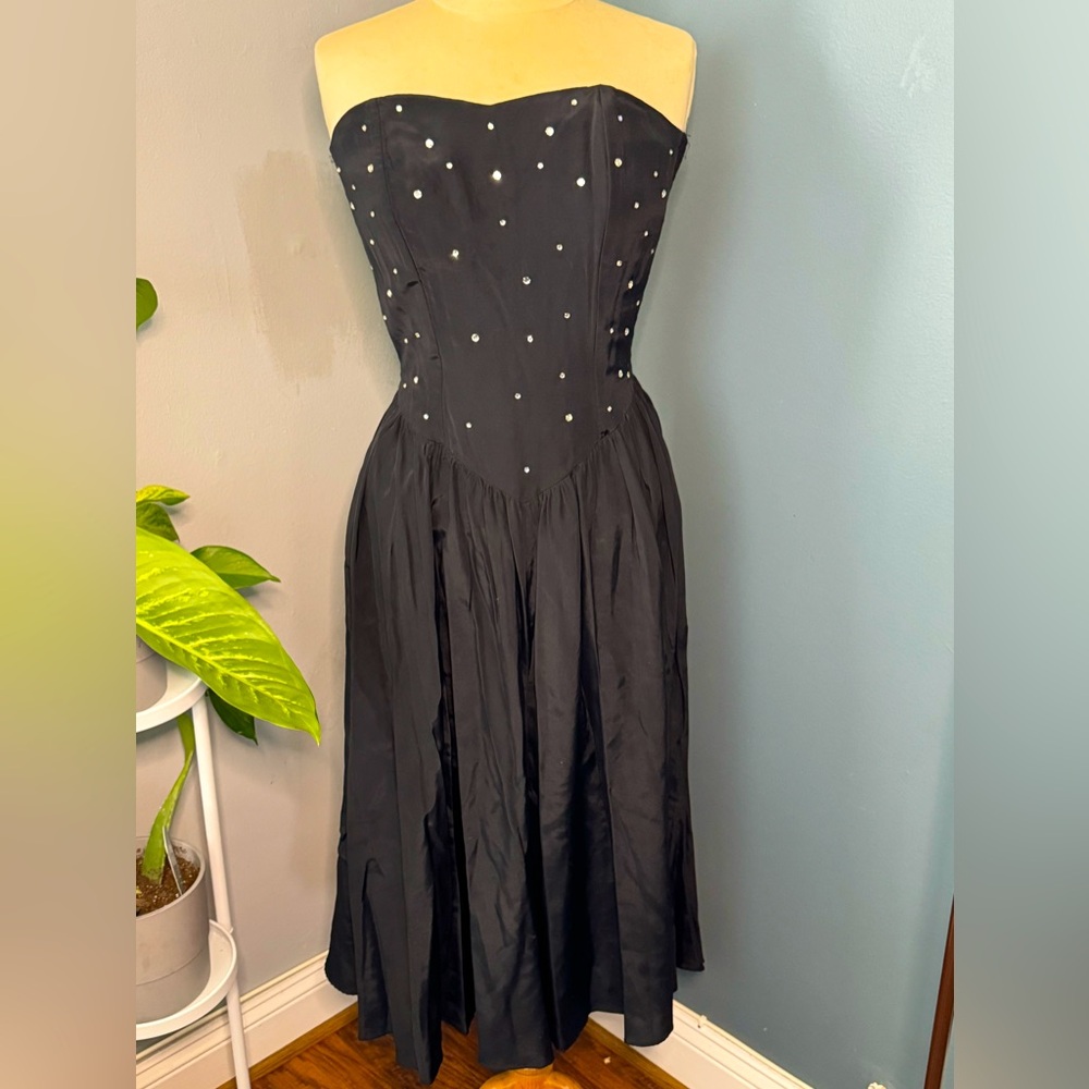 Simple black strapless dress.